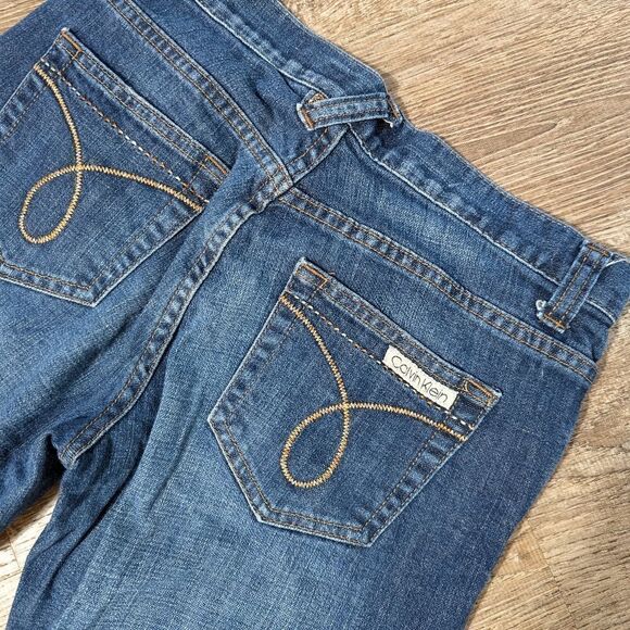 Calvin Klein Regular Wash Low Rise Flare Jeans - Picture 4 of 6